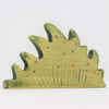 The Handmade Wooden Wildflower Patch is crafted from sustainable hardwood, shaped like a bush with green wavy edges, and adorned with colorful painted flowers and butterflies, using non-toxic plant-based stains for an eco-friendly touch.