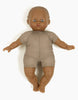 The Minikane Soft Body Doll (11") - Suzie is made from phthalate-free vinyl, features painted facial details, wears a taupe short-sleeved one-piece, and lies on a white background—ideal for imaginative play.
