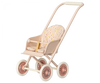 A Maileg Miniature Stroller, Micro - Powder with a light pink frame, four pink wheels, and a fabric seat featuring a polka dot pattern with various colors. The stroller has a handlebar for pushing and a safety belt with a yellow and white design.