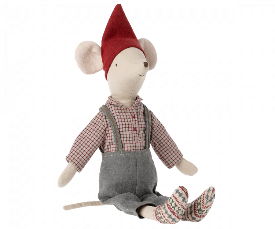 The Maileg Medium Christmas Mouse is dressed in a red pointed hat, a checkered shirt, grey overalls with suspenders, and patterned socks. The toy is seated with its legs extended forward.