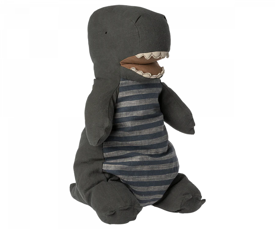 A plush toy dinosaur resembling a Maileg Large Dark Green Gantosaurus Dinosaur, specifically a T-Rex, with a dark gray body and lighter gray horizontal stripes on its belly. It features a large mouth with visible white teeth and small stubby arms and legs, crafted from soft mix fabric for extra cuddliness.