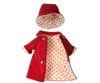 The Maileg Extra Clothing: Rain Coat for Teddy Mum is on display against a plain backdrop, showcasing its vibrant red design complete with a matching hat. Both pieces feature a charming white lining adorned with red polka dots and the raincoat includes two silver buttons, making it an ideal addition to your Teddy Mum collection.