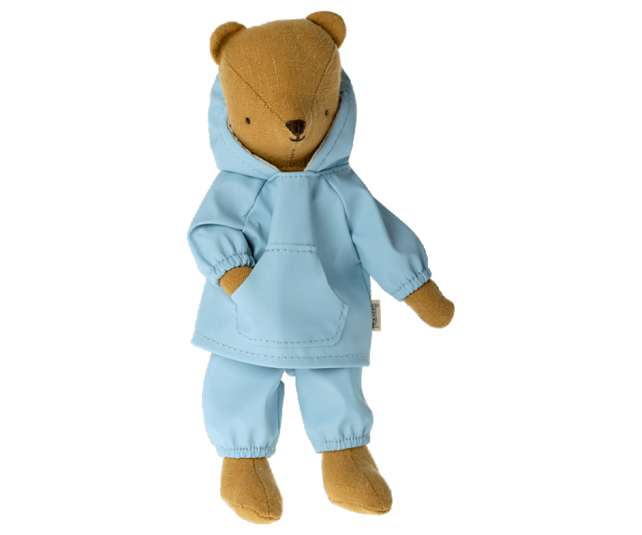 Introducing Teddy Junior, the charming brown teddy bear dressed in his stylish light blue hoodie and matching pants from the Maileg Extra Clothing line. Standing upright with slightly outstretched arms, he's ready to take on any adventure.