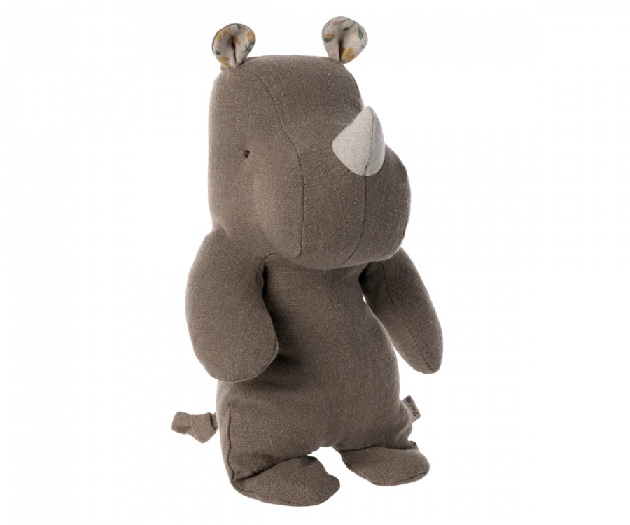 Gray Small Maileg Rhino plush toy standing upright with a visible white horn and small ears, crafted from the softest fabric, isolated on a black background.