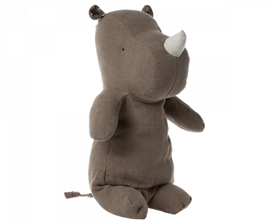 Meet your new Safari friend, the Maileg Medium Rhino—a plush toy resembling a dark brown rhinoceros with small round ears and a white horn. Its minimalistic design allows it to sit upright, ready to offer the best hug with its soft embrace.