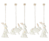 A set of Maileg Easter Bunny Ornaments, 5 pcs. adorned with small flowers and greenery designs. Each rabbit is hanging from a string tied to a small flower at the top. These Easter decorations feature rabbits in various poses, including sitting and standing.