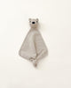 A beige colored small merino wool lovey with a head of a teddy bear at top.