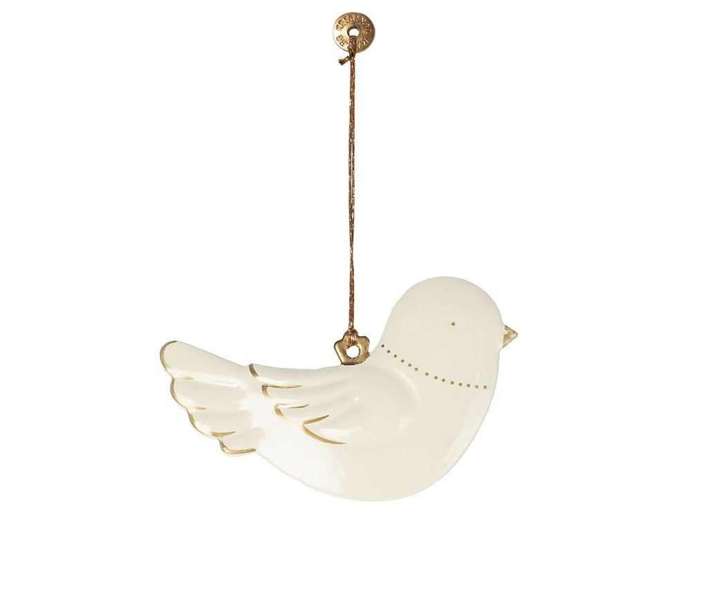 A Maileg Metal Bird Ornament hangs from a brown string attached to a brass knob. The bird, with minimalist features, has a smooth finish and simple wing detailing lightly outlined in gold. Perfect for a Christmas tree, the overall design is clean and elegant.