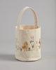 The Coral & Tusk Spring Babies Canvas Bucket is a charming tote featuring embroidered animals like sheep, chick, rabbit, and donkey on the handle. The vibrant design pops against the plain background, making it an ideal Easter basket for festive celebrations.