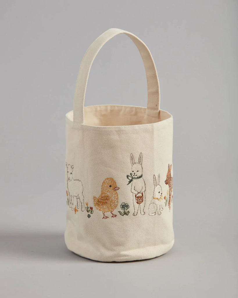 The Coral & Tusk Spring Babies Canvas Bucket is a charming tote featuring embroidered animals like sheep, chick, rabbit, and donkey on the handle. The vibrant design pops against the plain background, making it an ideal Easter basket for festive celebrations.