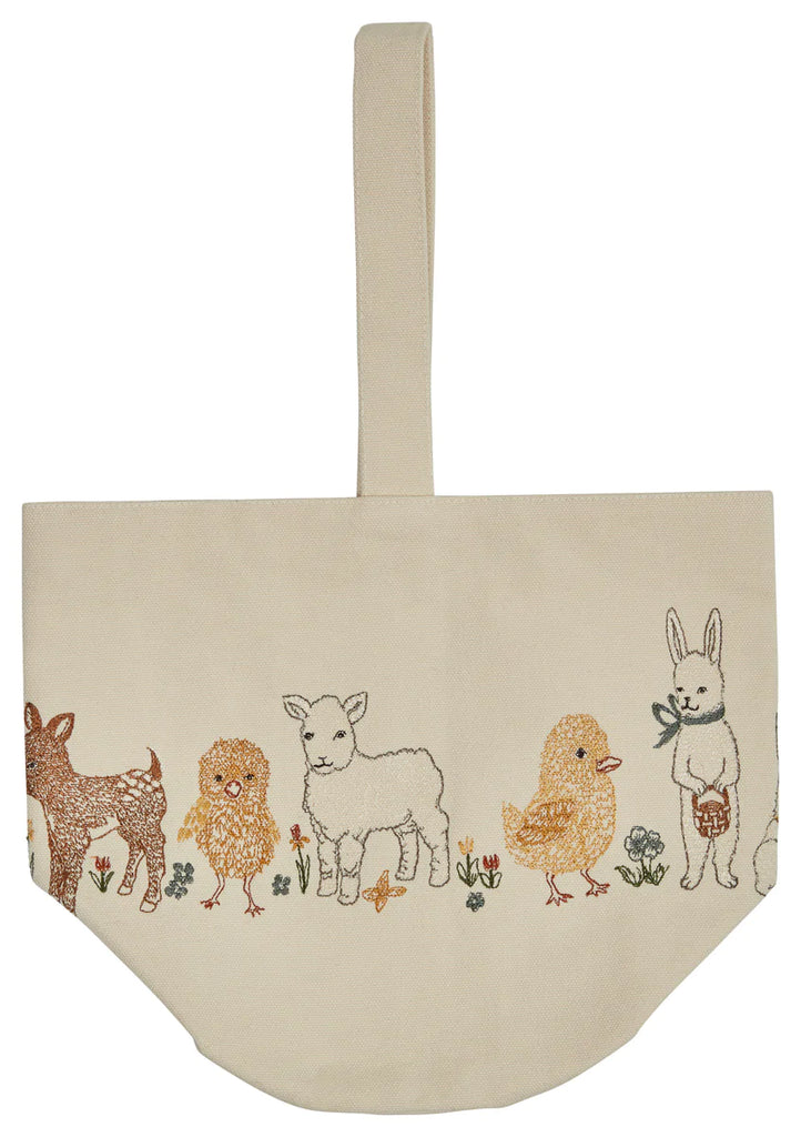 The Coral & Tusk Spring Babies Canvas Bucket is a beige embroidered tote with a handle. It showcases a fawn, chick, lamb, duckling, and rabbit nestled among vibrant flowers and leaves in colorful thread—ideal for an Easter basket or daily use.