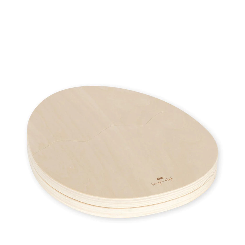 A stack of Dinosaur Egg Puzzle made from sustainably sourced beechwood, with visible wood grain, on a white background.