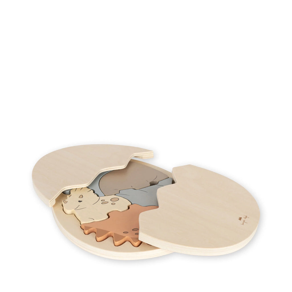 Wooden puzzle designed as a circular Dinosaur Egg Puzzle shape with a mouse in the middle, composed of various interlocking pieces, painted with non-toxic water-based paint, set against a plain white background.