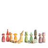 A collection of colorful, assorted Grapat Fancy Nins wooden toy figurines arranged in a line against a white background. The shapes vary from simple cones to more intricate designs with curves and layered segments.