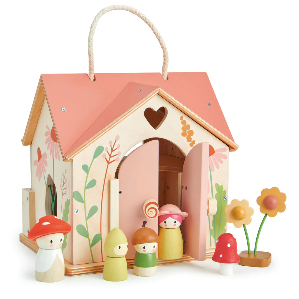 The Rosewood Cottage toy set comes with a floral carrying case, pastel mushroom and gnome figures, a snail, flower pieces, an open door for play, and a rope handle.