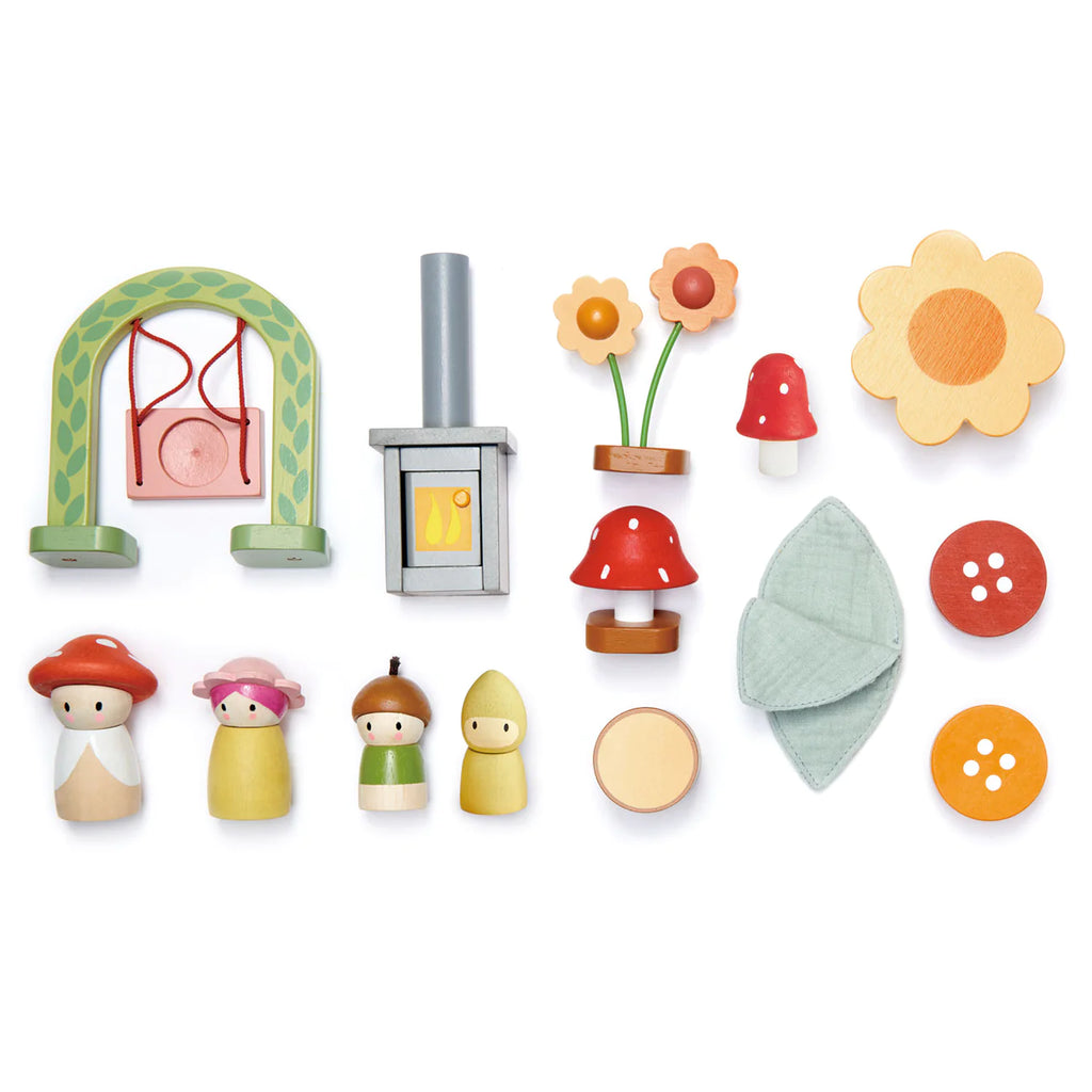 The Rosewood Cottage is a collection of colorful wooden toys on a white background, evoking woodland charm with a swing, small stove, flowers, mushrooms, leaves, buttons, and four differently colored peg dolls.