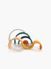 A collection of Handmade Mini Rainbow Stacker - Lagoon headbands laid out overlapping each other, with colors including orange, teal, gray, and bronze against a white background.