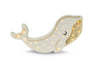 A decorative Little Lights Whale Lamp with a smiling face, glittering body, and internal lighting that glows through star-shaped cutouts, crafted from natural pinewood, isolated on a white background.